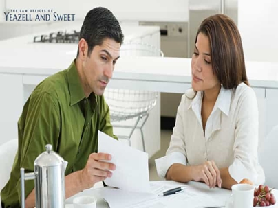 Two People Looking at Documents